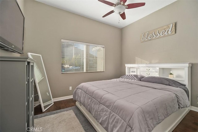 bedroom featuring ceiling fan and dark hardwood / wood-style floors