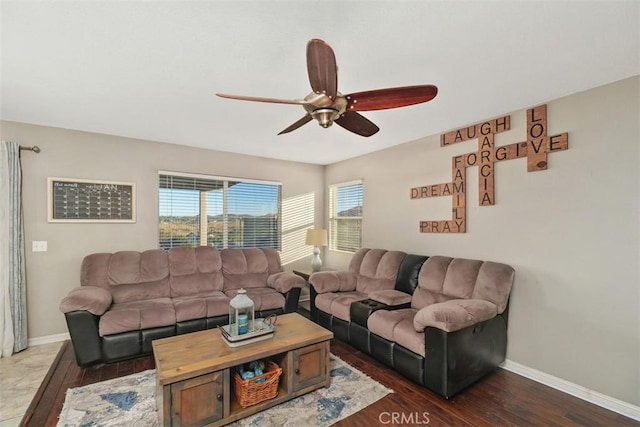 living room with ceiling fan and dark hardwood / wood-style floors