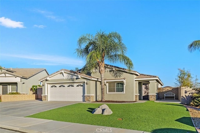 view of front of house featuring a front yard and a garage