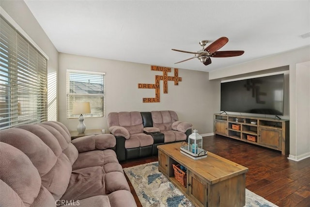 living room with ceiling fan and dark wood-type flooring