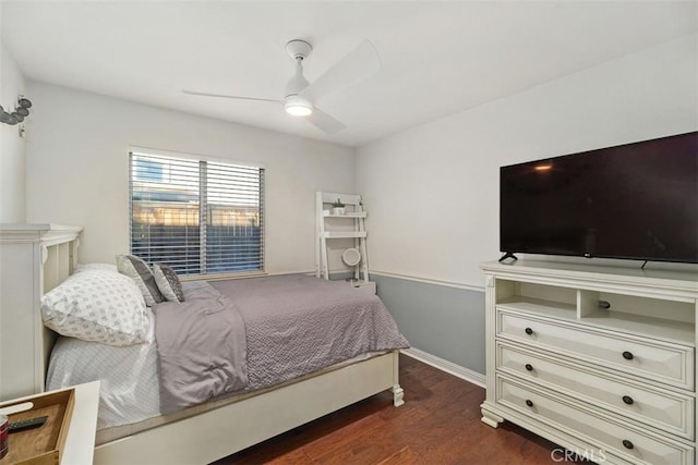 bedroom featuring dark hardwood / wood-style flooring and ceiling fan