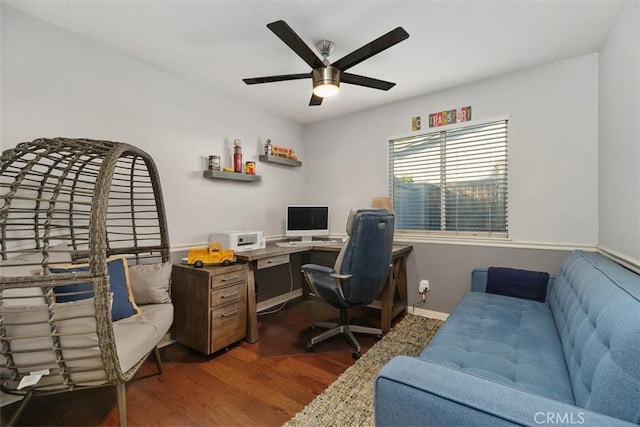 office with dark wood-type flooring and ceiling fan