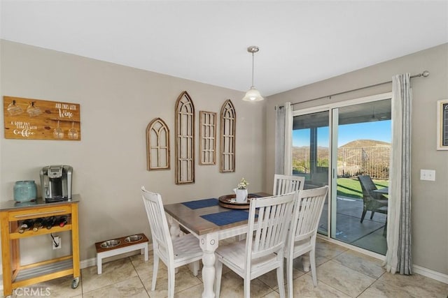 tiled dining area featuring a mountain view