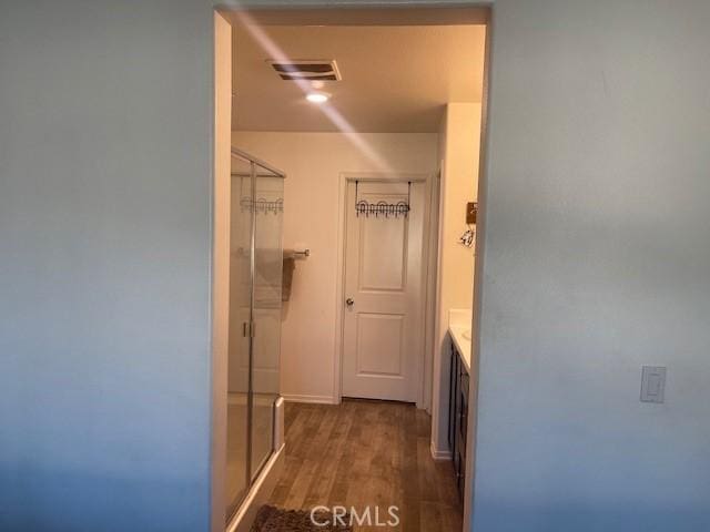 hallway featuring dark hardwood / wood-style flooring