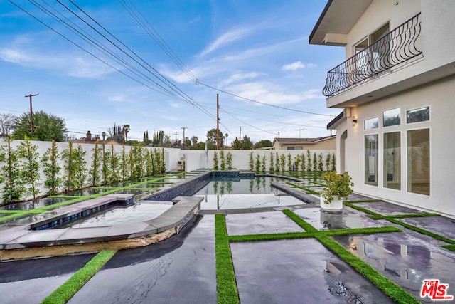 view of swimming pool with a patio area