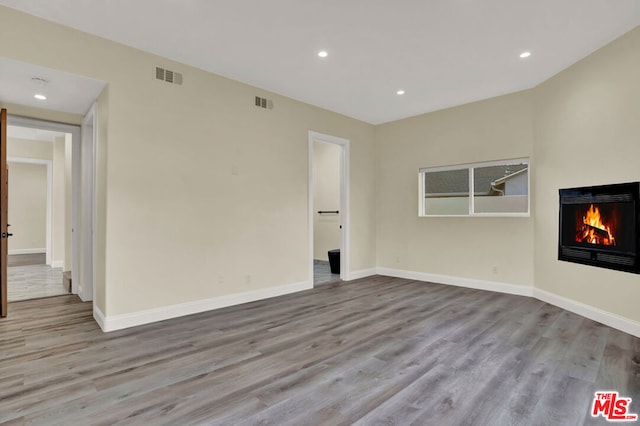 spare room with light wood-type flooring