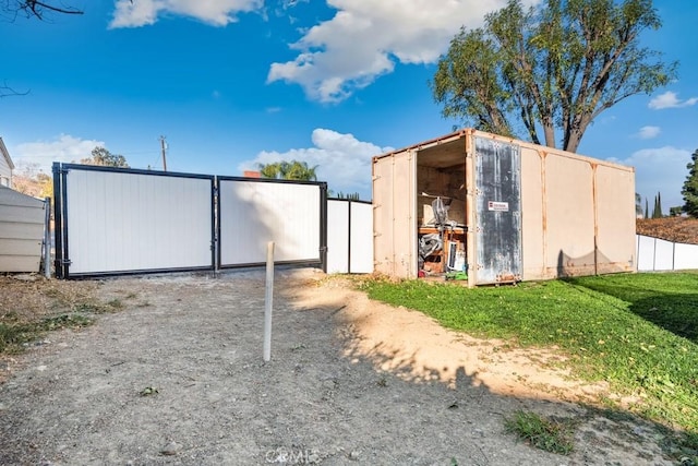 view of outdoor structure with a lawn