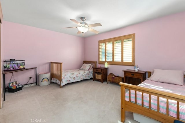 bedroom featuring light carpet and ceiling fan