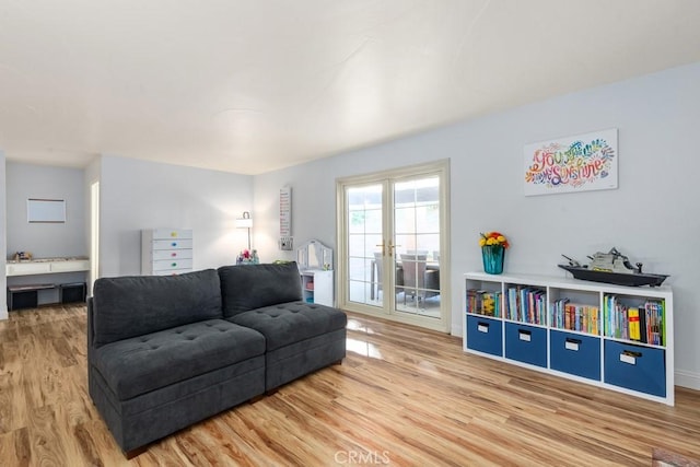 living room featuring french doors and wood-type flooring