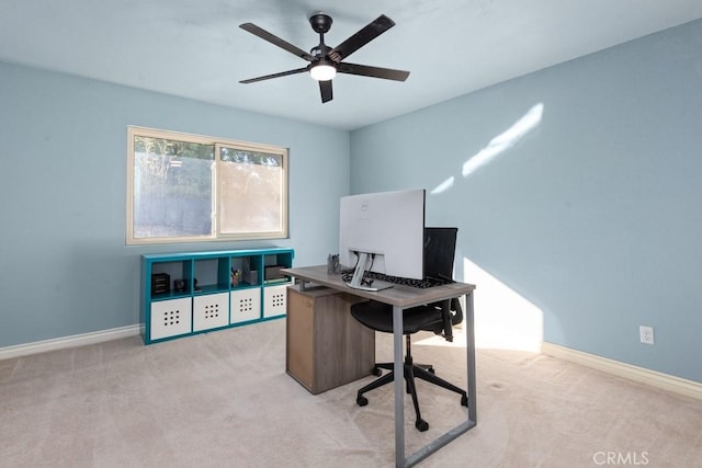 carpeted office space with ceiling fan