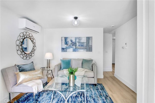 living room with an AC wall unit and light wood-type flooring