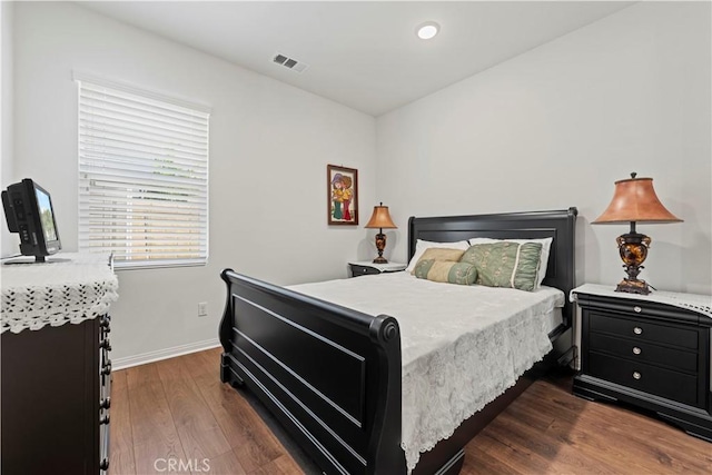 bedroom featuring dark hardwood / wood-style floors