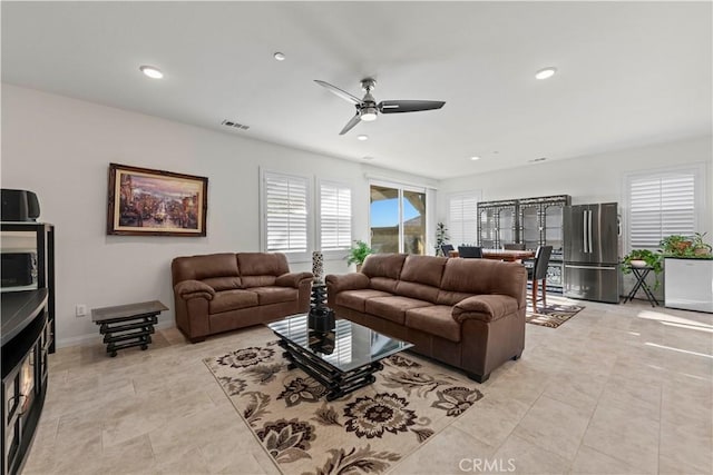 living room featuring ceiling fan