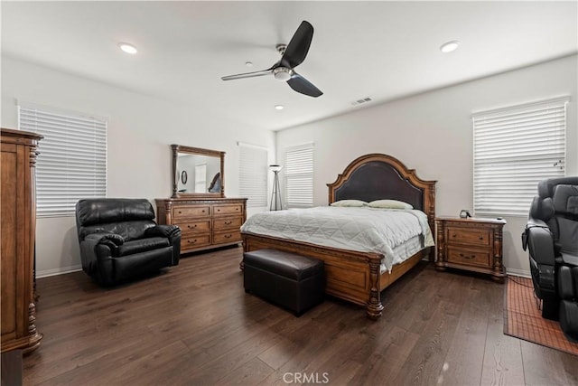 bedroom with ceiling fan and dark wood-type flooring