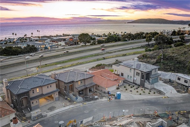 aerial view with a water view and a residential view