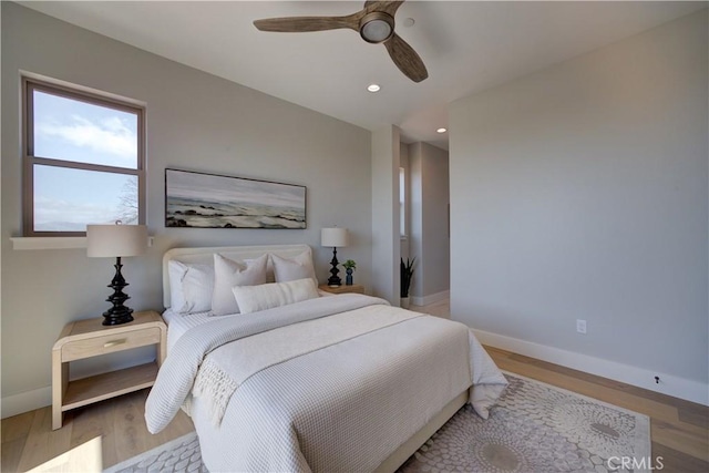 bedroom featuring recessed lighting, baseboards, and wood finished floors