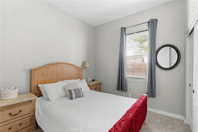 carpeted bedroom featuring a closet