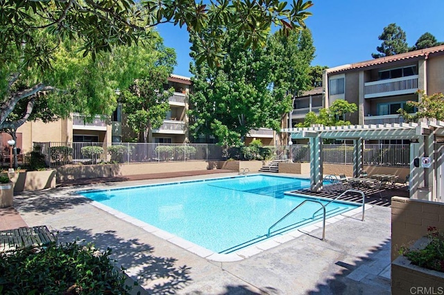 view of swimming pool with a pergola