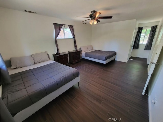 45412 N Oakview Dr, Oakhurst, CA 93644 - bedroom with wood finished floors, multiple windows, and a ceiling fan