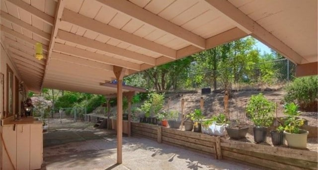 view of patio featuring fence