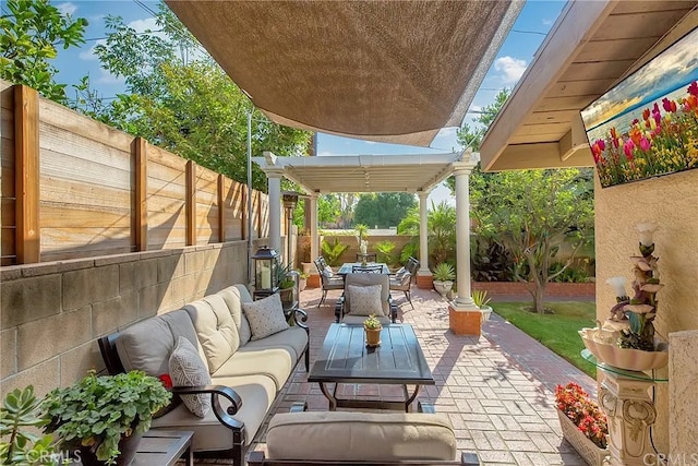 view of patio / terrace featuring outdoor dining area, outdoor lounge area, a fenced backyard, and a pergola