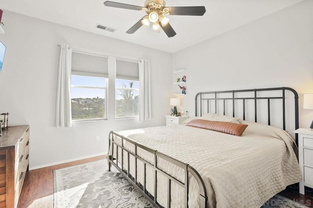 bedroom with wood-type flooring and ceiling fan