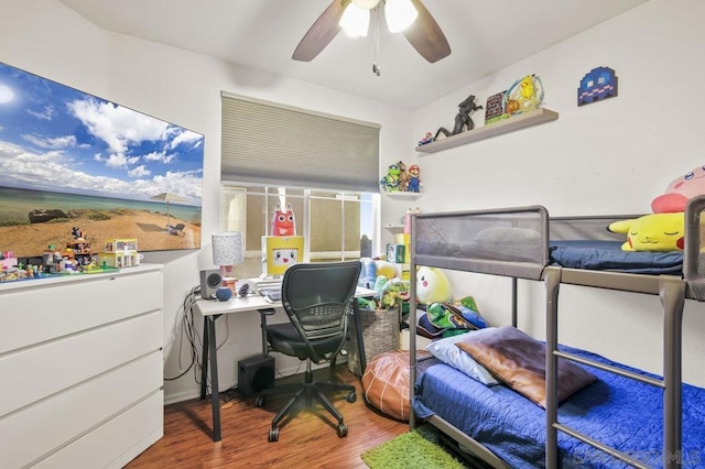 bedroom with ceiling fan and hardwood / wood-style flooring