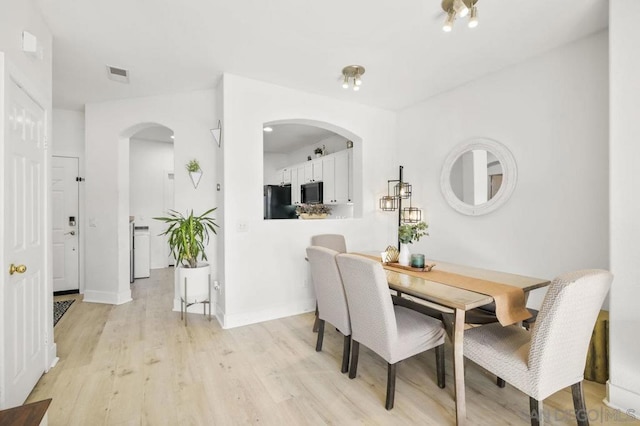 dining room with light hardwood / wood-style floors