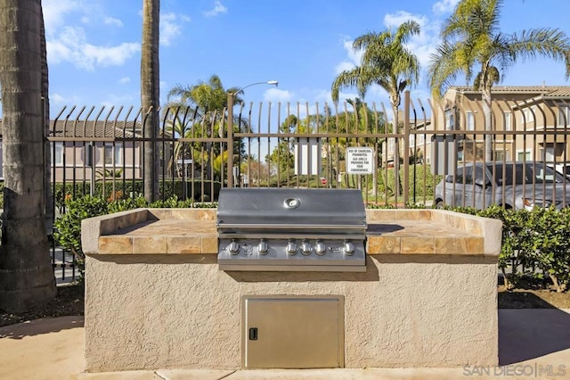 view of patio / terrace featuring exterior kitchen and area for grilling