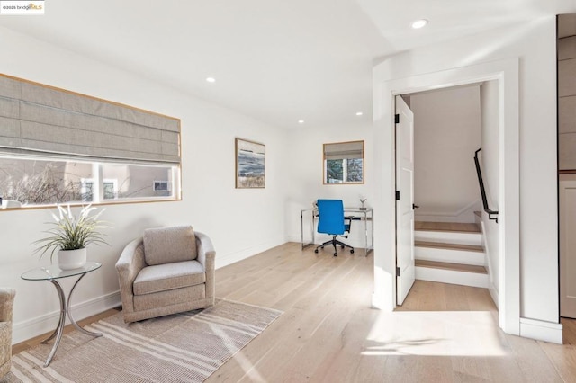 living area with light hardwood / wood-style flooring