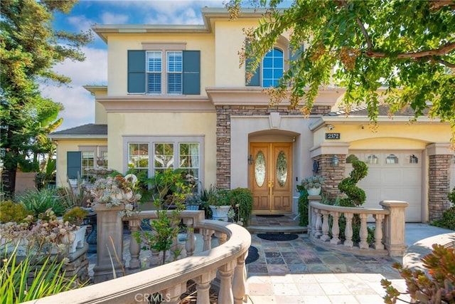 view of front of property with a garage