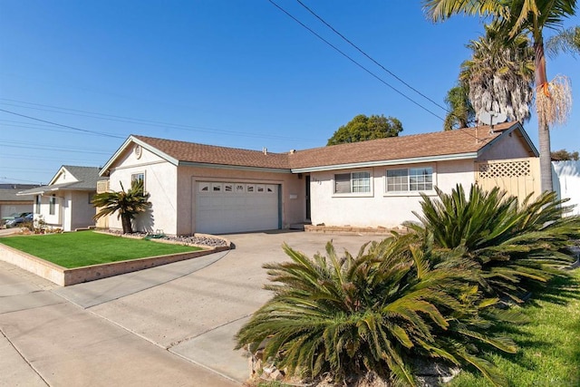 view of front of home with a front yard and a garage