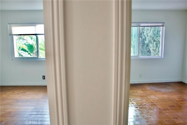 corridor featuring wood-type flooring