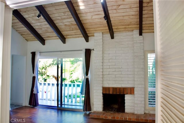 unfurnished living room featuring a fireplace, a wealth of natural light, wood ceiling, and vaulted ceiling with beams