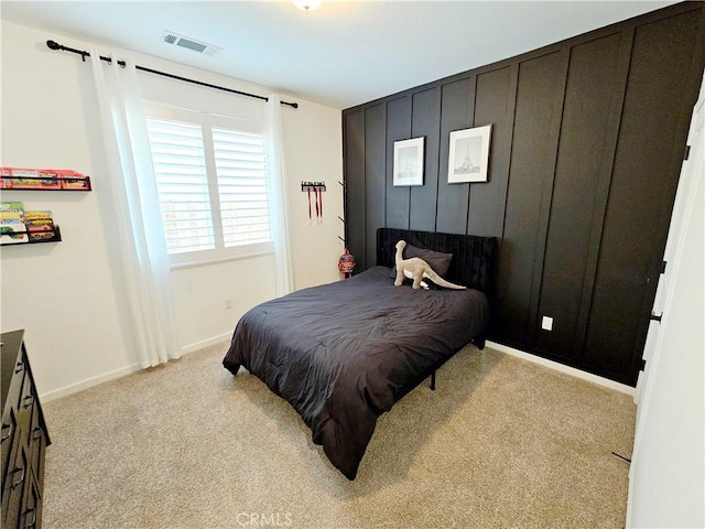 bedroom with light colored carpet