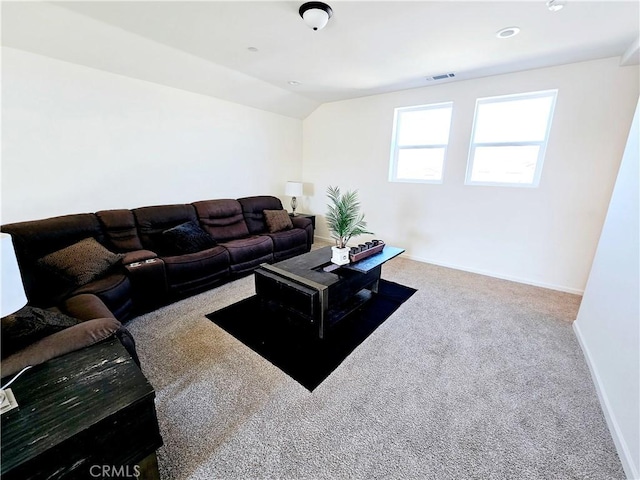 living room with lofted ceiling and carpet flooring