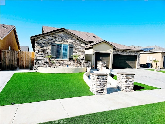 view of front facade featuring a garage and a front lawn