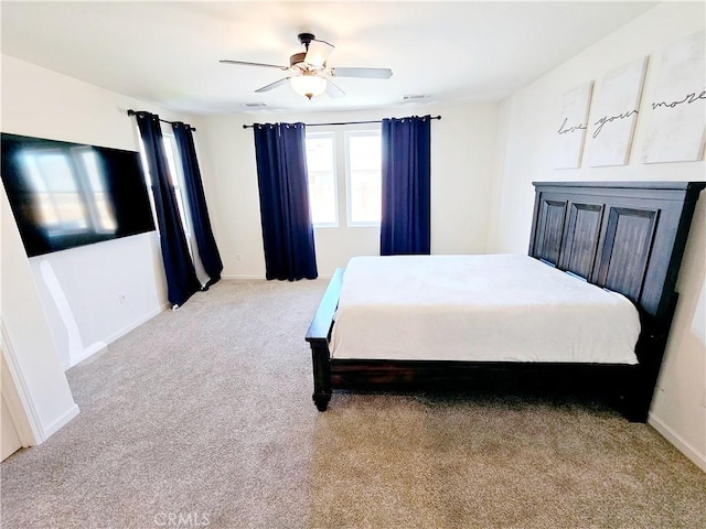 bedroom with light colored carpet and ceiling fan