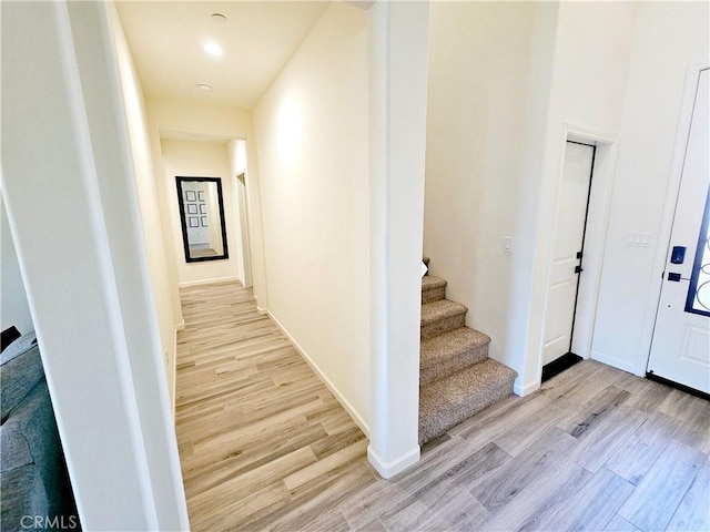 corridor with light wood-type flooring