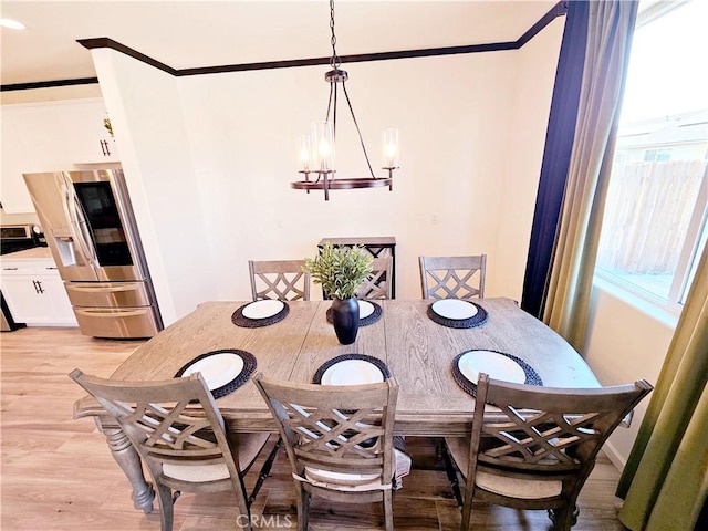 dining room featuring light hardwood / wood-style floors and an inviting chandelier