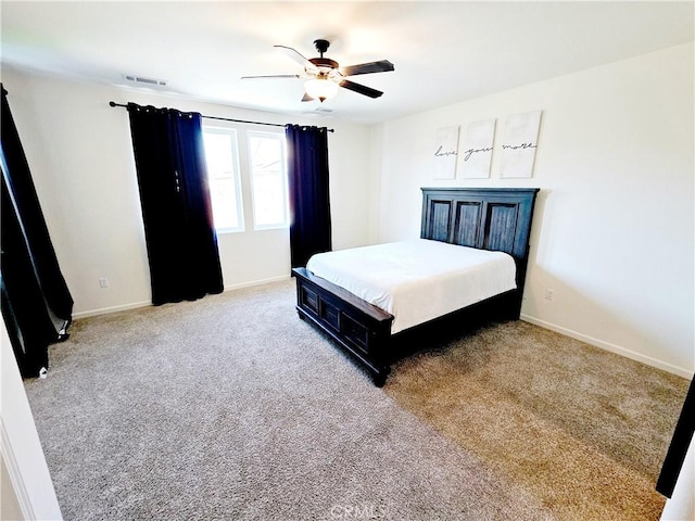 bedroom featuring ceiling fan and carpet