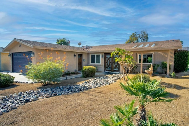 single story home featuring a garage