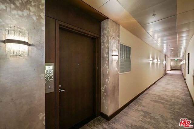 hallway with light colored carpet