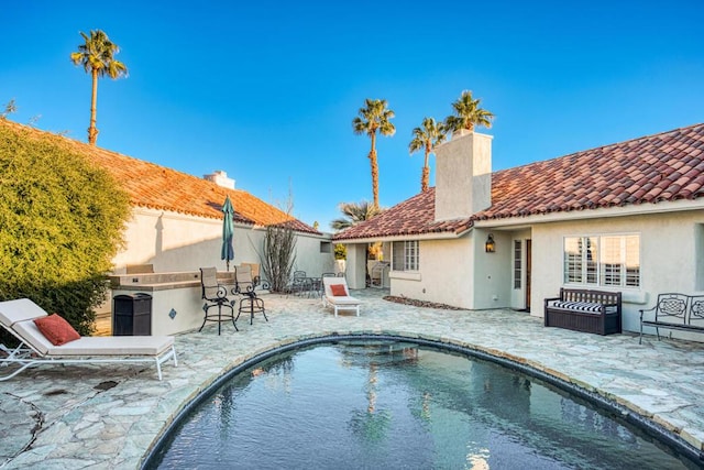 view of pool featuring a patio area