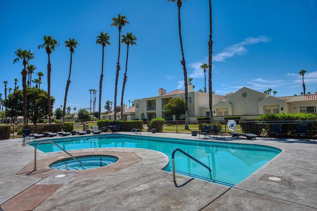 view of pool with a community hot tub and a patio