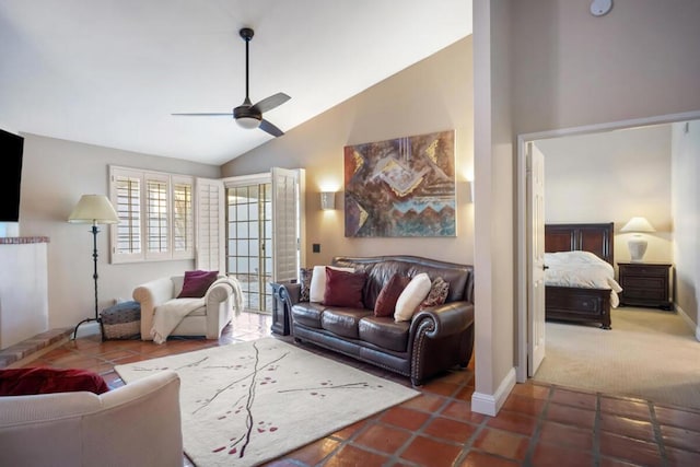 tiled living room with ceiling fan and vaulted ceiling