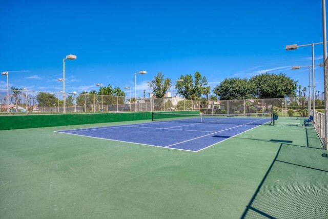 view of tennis court featuring basketball court