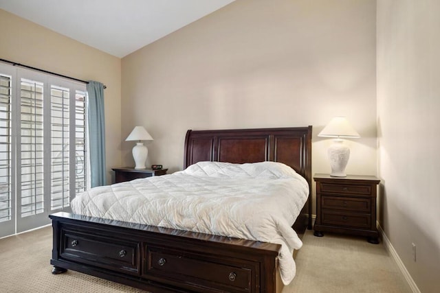 carpeted bedroom featuring vaulted ceiling