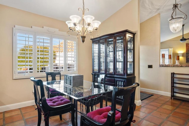 dining area with an inviting chandelier, vaulted ceiling, and tile patterned floors