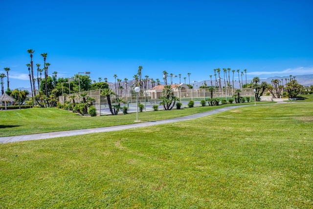 view of property's community featuring a yard